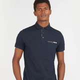 Male wears the Barbour Mens Corpatch Polo Shirt in navy