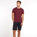 Man styles the Barbour Mens Essential Sports T-shirt in Ruby with a pair of shorts