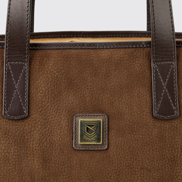 Close up on the logo detail of the Dubarry Rosemount Tote Bag in Walnut