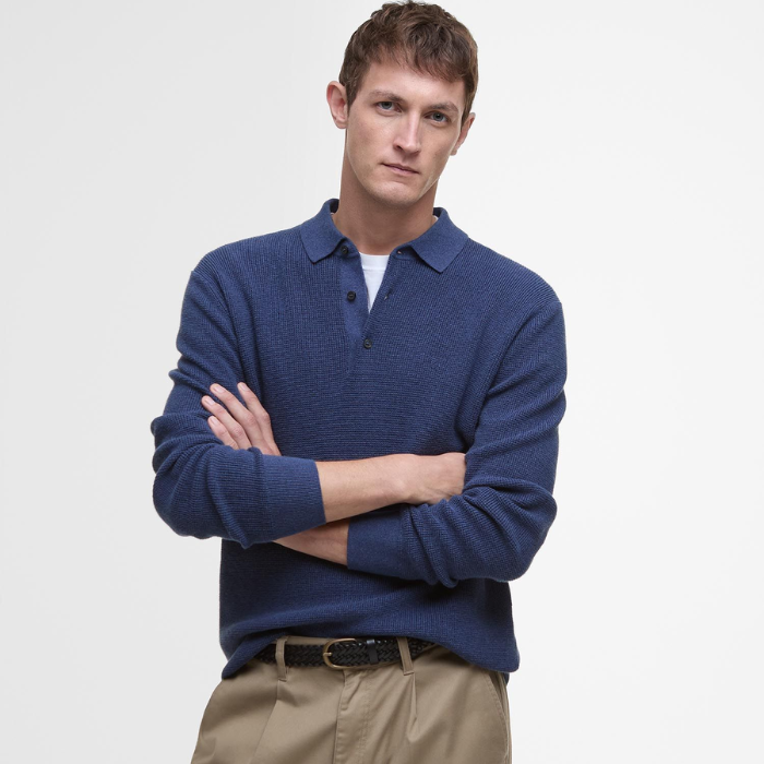 Male poses arms crossed in the Barbour Mens Holt Waffle Knitted Polo Shirt in Oceana