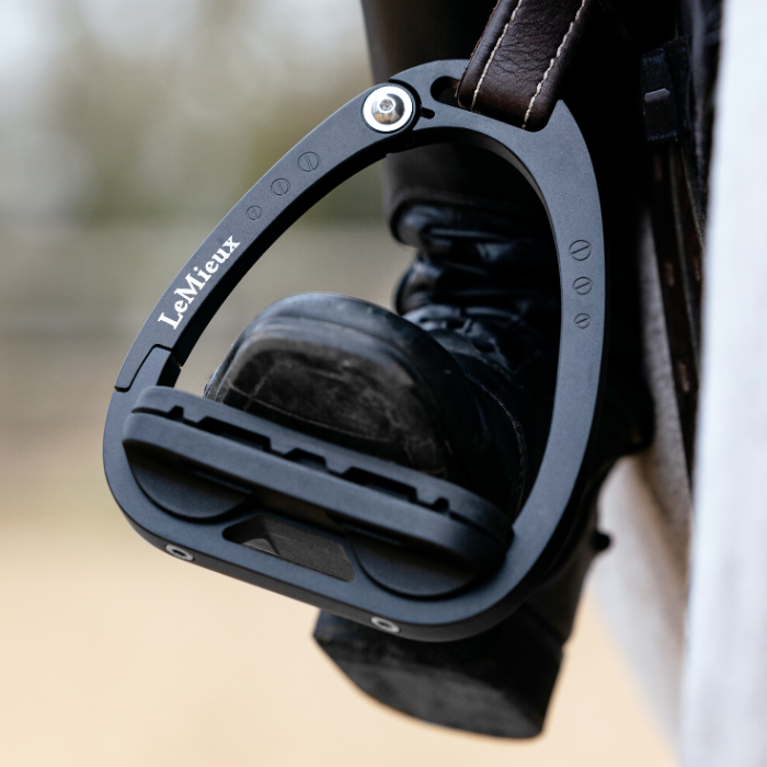 Rider's foot in the LeMieux Junior Vector Balance Stirrups in Black