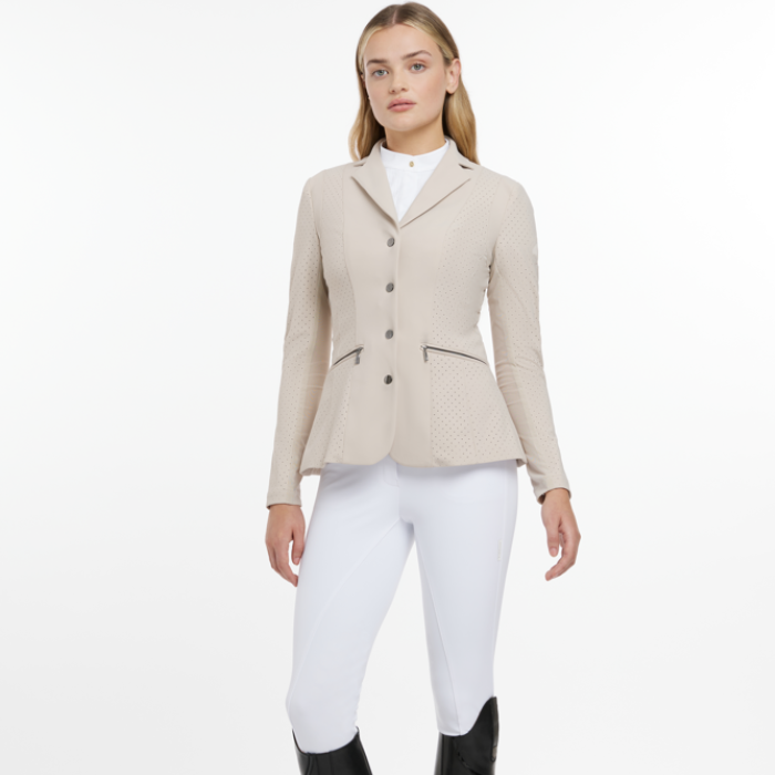 Female equestrian wears the LeMieux Jessica Mesh Show Jacket in stone