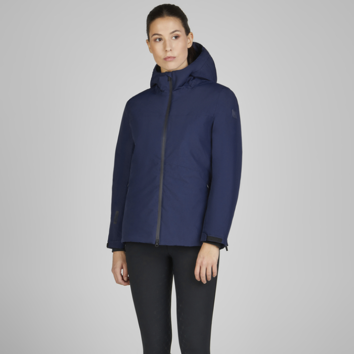 Woman showing the front of the Eskadron Heritage Waterproof Jacket in True Blue