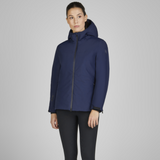 Woman showing the front of the Eskadron Heritage Waterproof Jacket in True Blue