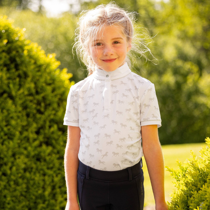 Girl wears the LeMieux Mini Bella Show Shirt in White