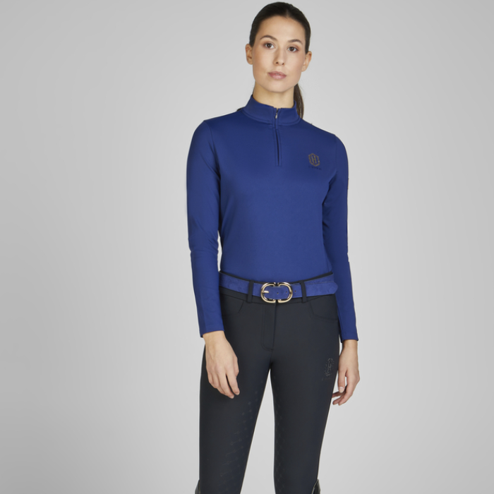 Woman wearing the Eskadron Heritage Faux Leather Belt in true blue