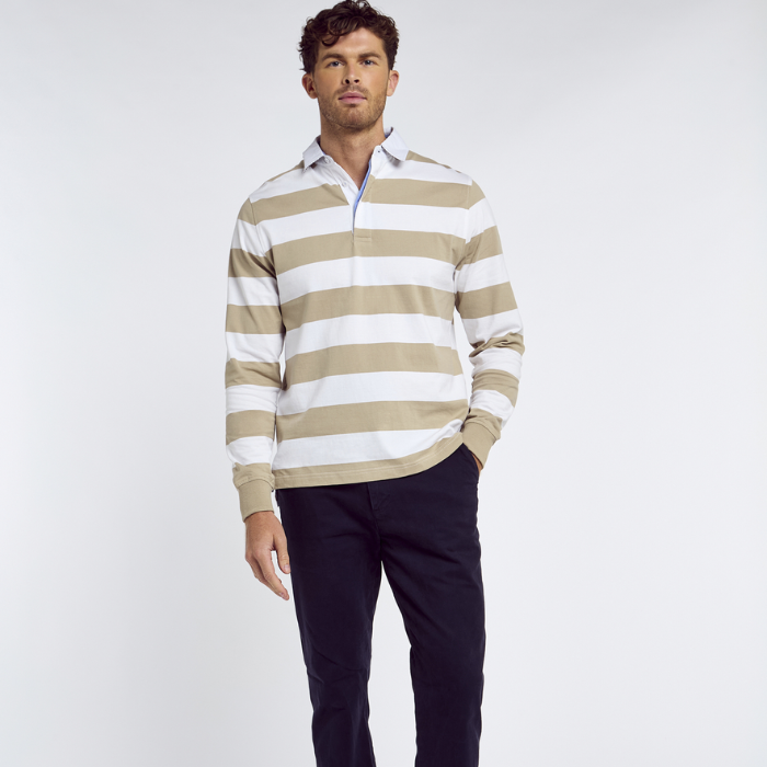 Man wears the Dubarry Mens Goresbridge Rugby Top in Sand Multi