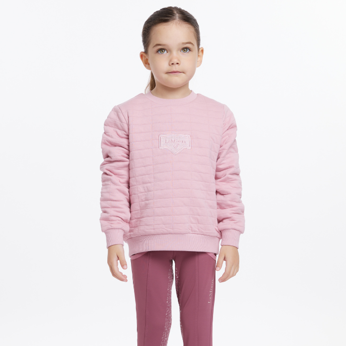 Young girl wears the LeMieux Mini Cici Crew in Blossom