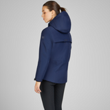 Woman showing the reverse of the Eskadron Heritage Waterproof Jacket in True Blue