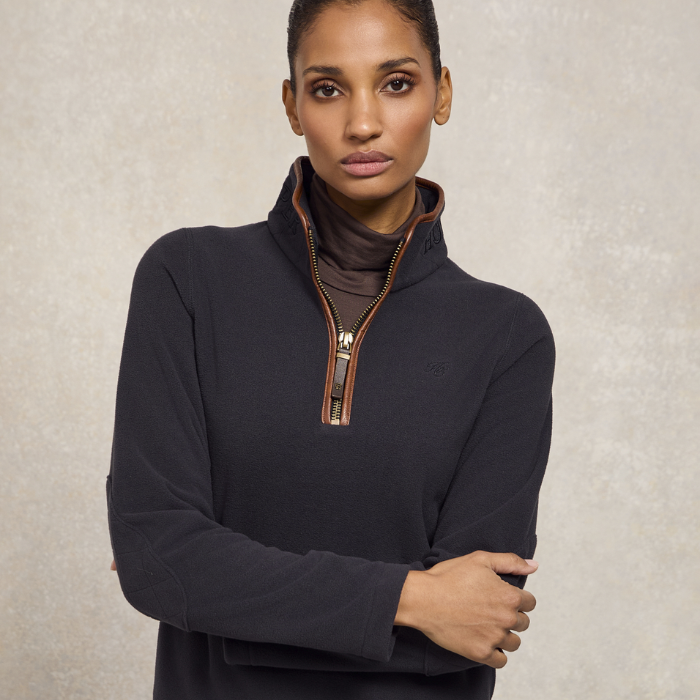 Woman wears the Holland Cooper Country Fleece Quarter Zip in Ink Navy