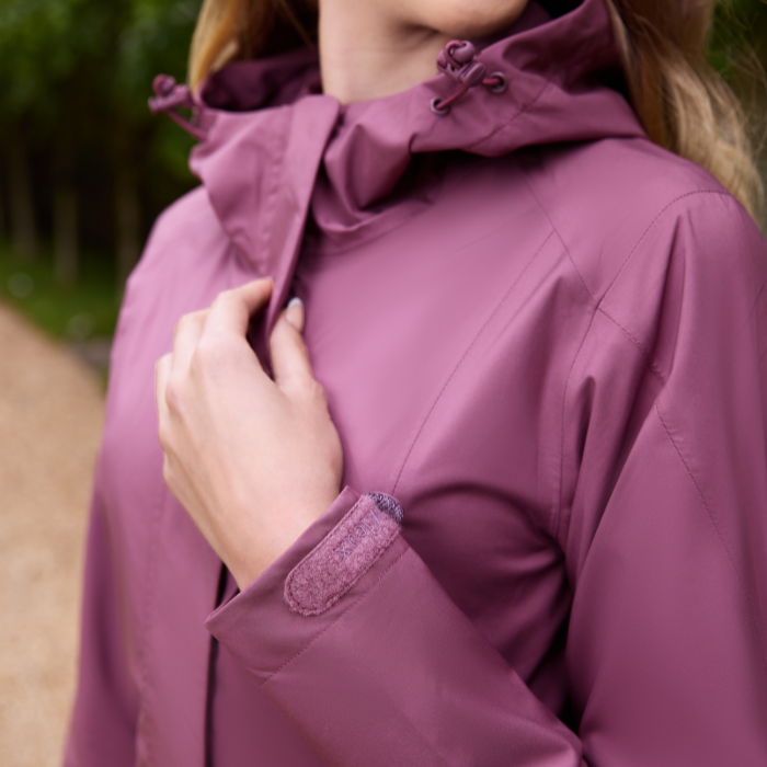 Close up of the front detail on the LeMieux Isla Short Waterproof Jacket in Rosewood