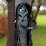 Black LeMieux Bridle Bracket fixed to a post with a bridle hanging