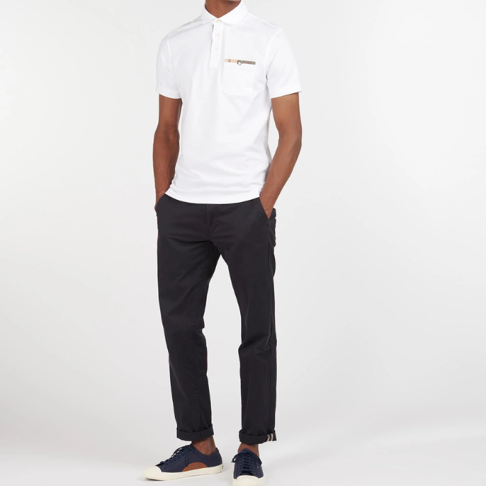 Male teams the Barbour Mens Corpatch Polo Shirt in white with a pair of smart trousers 