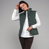 Woman in a studio wears the Toggi Ladies Storford Quilted Gilet in Dark Khaki