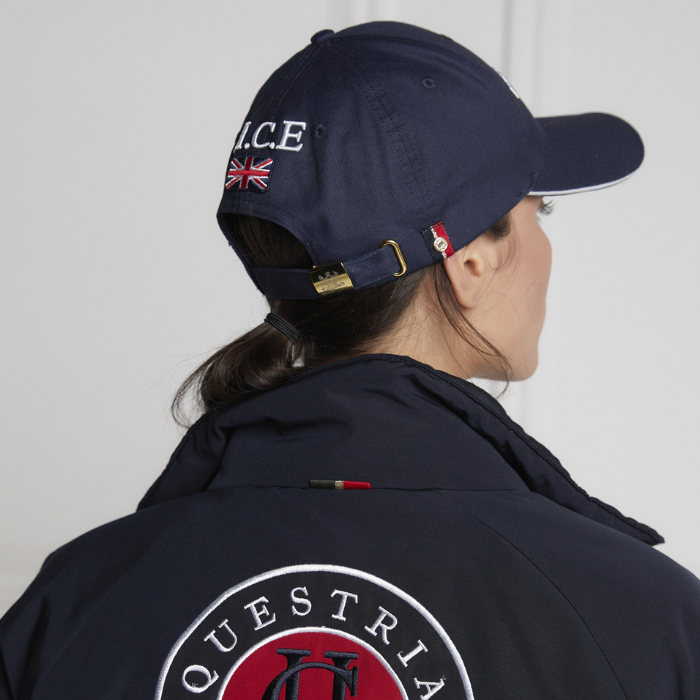 Lady faces away to show the reverse of the Holland Cooper HC Equestrian Cap in Ink Navy