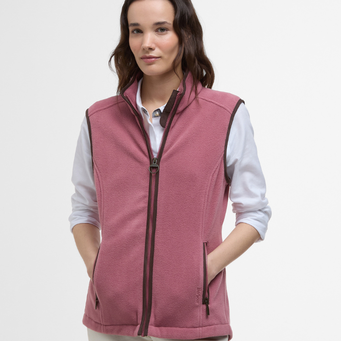 Female styles the Barbour Ladies Country Colton Fleece Gilet in Deep Pruce with a crisp white shirt