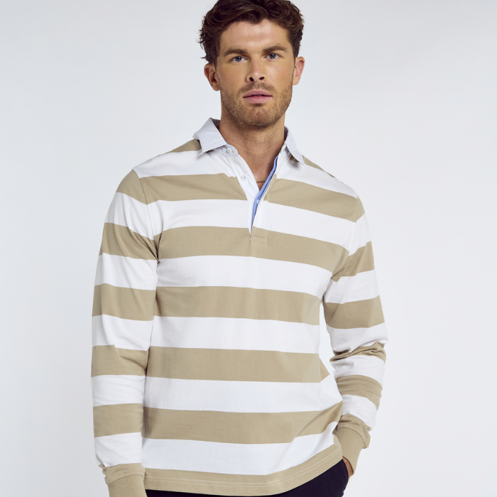 Man wears the Dubarry Mens Goresbridge Rugby Top in Sand Multi