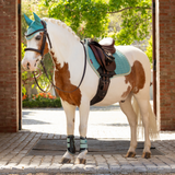 Small pony wears the LeMieux Mini Suede Close Contact Square in lagoon with coordinating accessories