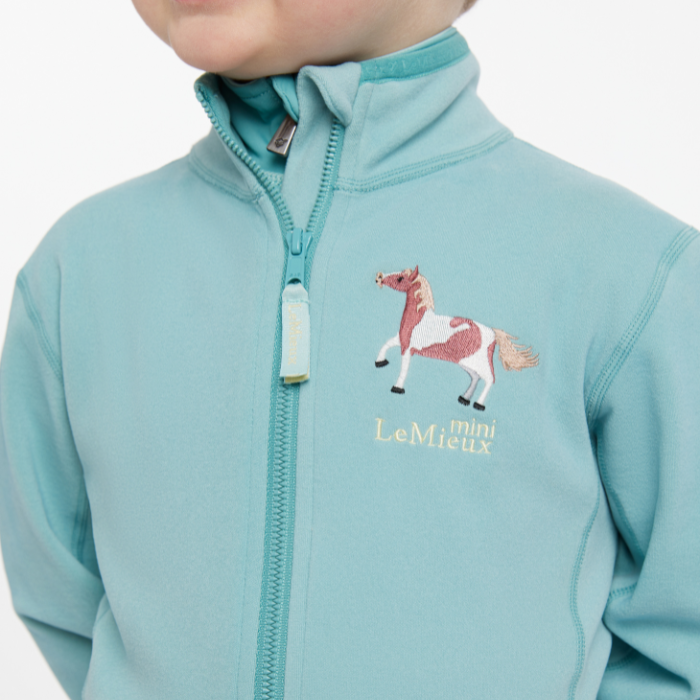 Close up embroidered horse detail on the LeMieux Mini Mari Micro Fleece in Aqua