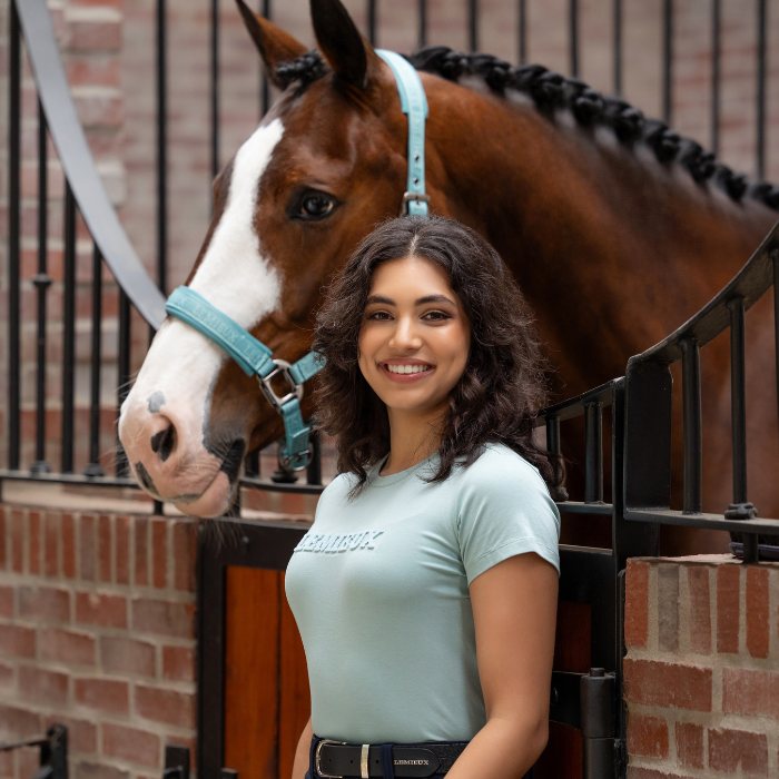 Woman stands with horse wearing the LeMieux Ladies Classique T-shirt in Aqua