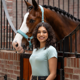 Woman stands with horse wearing the LeMieux Ladies Classique T-shirt in Aqua