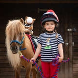 Child stands with pony wearing the Shires Childrens Winnie & Me T-shirt in Navy Stripe