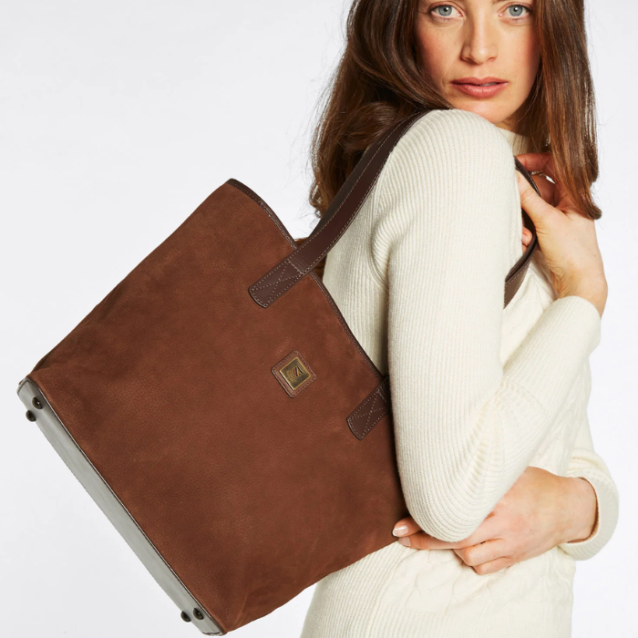 Woman drapes the Dubarry Rosemount Tote Bag in Walnut over her shoulder