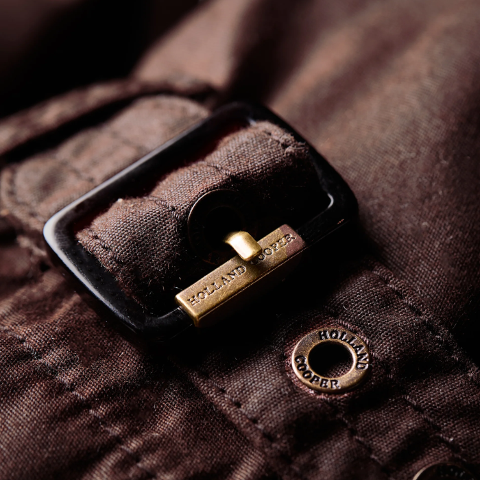 Luxury cuff logo detail on Holland Cooper Durham Wax Jacket in Chocolate