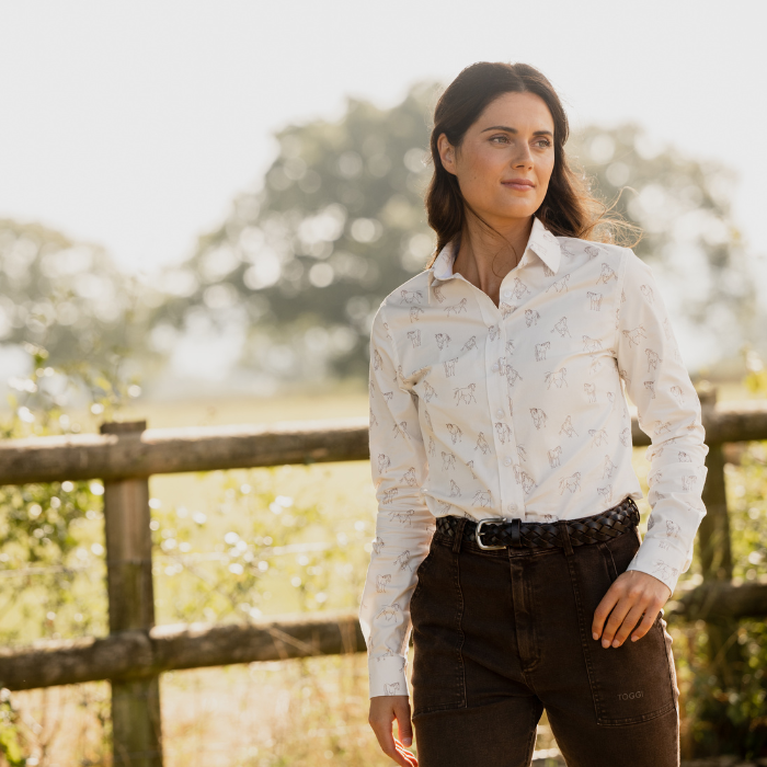 Woman stands outdoors wearing the Toggi Ladies Eaton Shirt in White/Horse Print