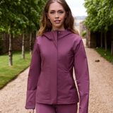 Female wears the LeMieux Isla Short Waterproof Jacket in Rosewood