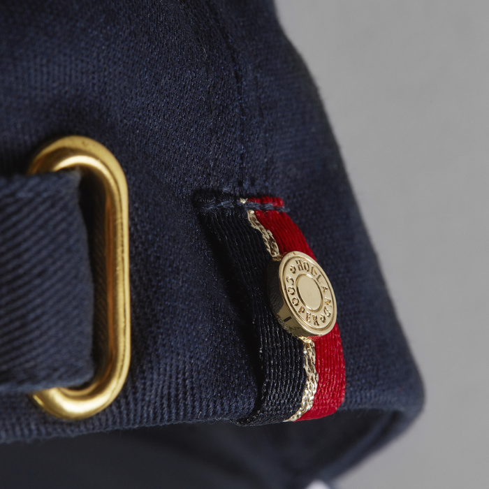 Close up logo detail on the Holland Cooper HC Equestrian Cap in Ink Navy