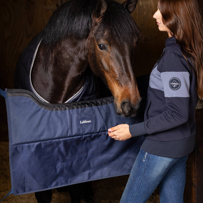 The Pro Stable Guard in Navy fitted to horse stable frame with horse secured inside stable