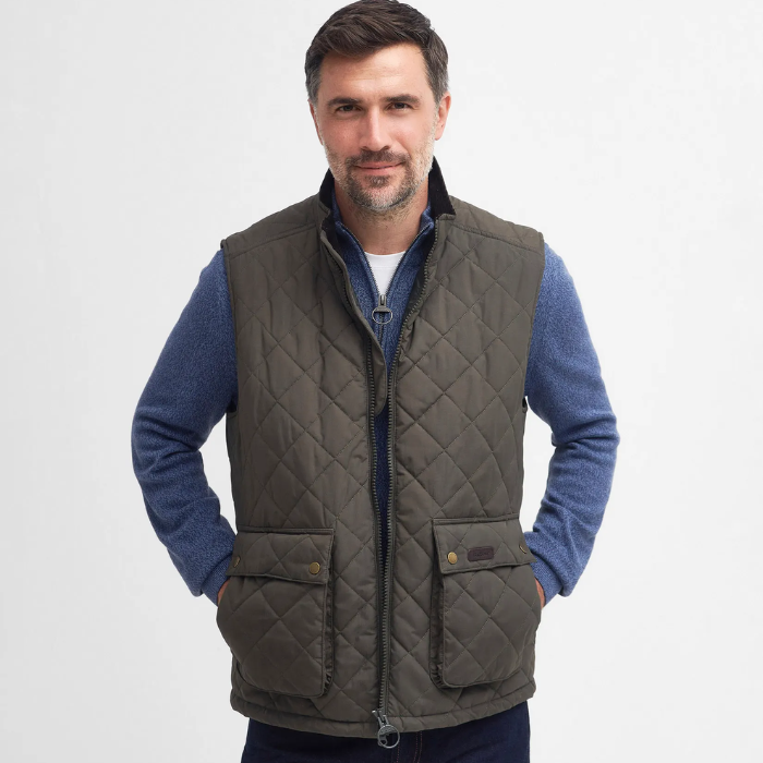 Man wearing the Barbour Mens Fernwood Gilet in Dark Olive