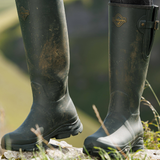 The LeMieux Ultra Stride Wellington Boots in Oak worn outdoors