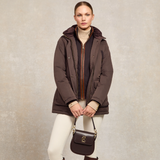 Lady styles the Holland Cooper Stamford Country Coat in Chocolate unzipped with the integrated gilet on display