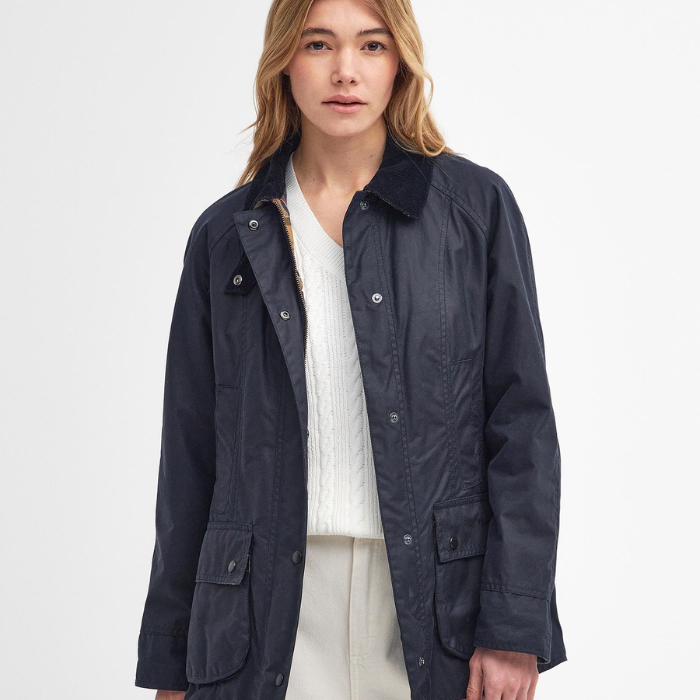 Woman wears the Barbour Ladies Beadnell Wax Jacket Navy