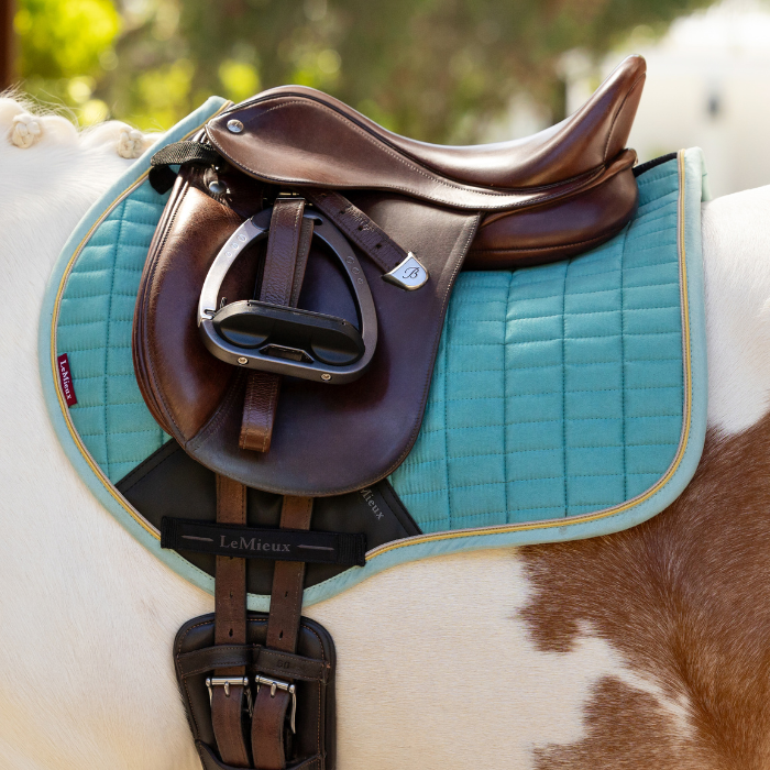 LeMieux Mini Suede Close Contact Square in Lagoon shown under saddle