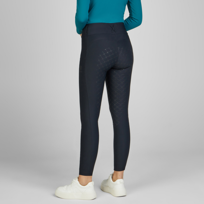 Woman facing away wearing the Eskadron Heritage Cosy Riding Tights