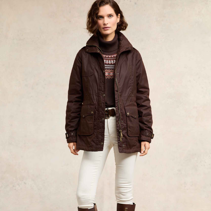 Woman wears the Holland Cooper Durham Wax Jacket in Chocolate