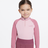 Young girl wears the LeMieux Mini Base Layer in Blossom