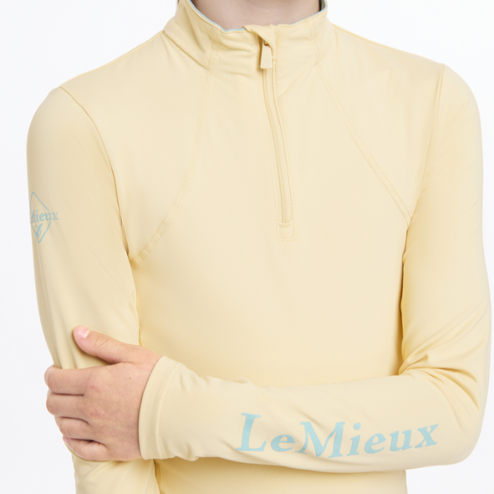 Logo sleeve detail on the LeMieux Young Riders Base Layer in mimosa