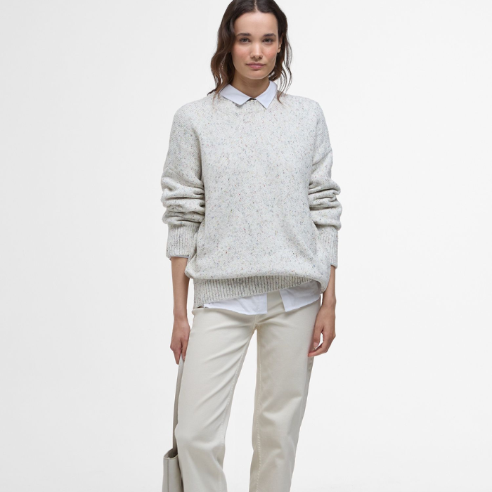 The Barbour Edda Knitted Jumper styled with a crisp white shirt and smart beige trousers